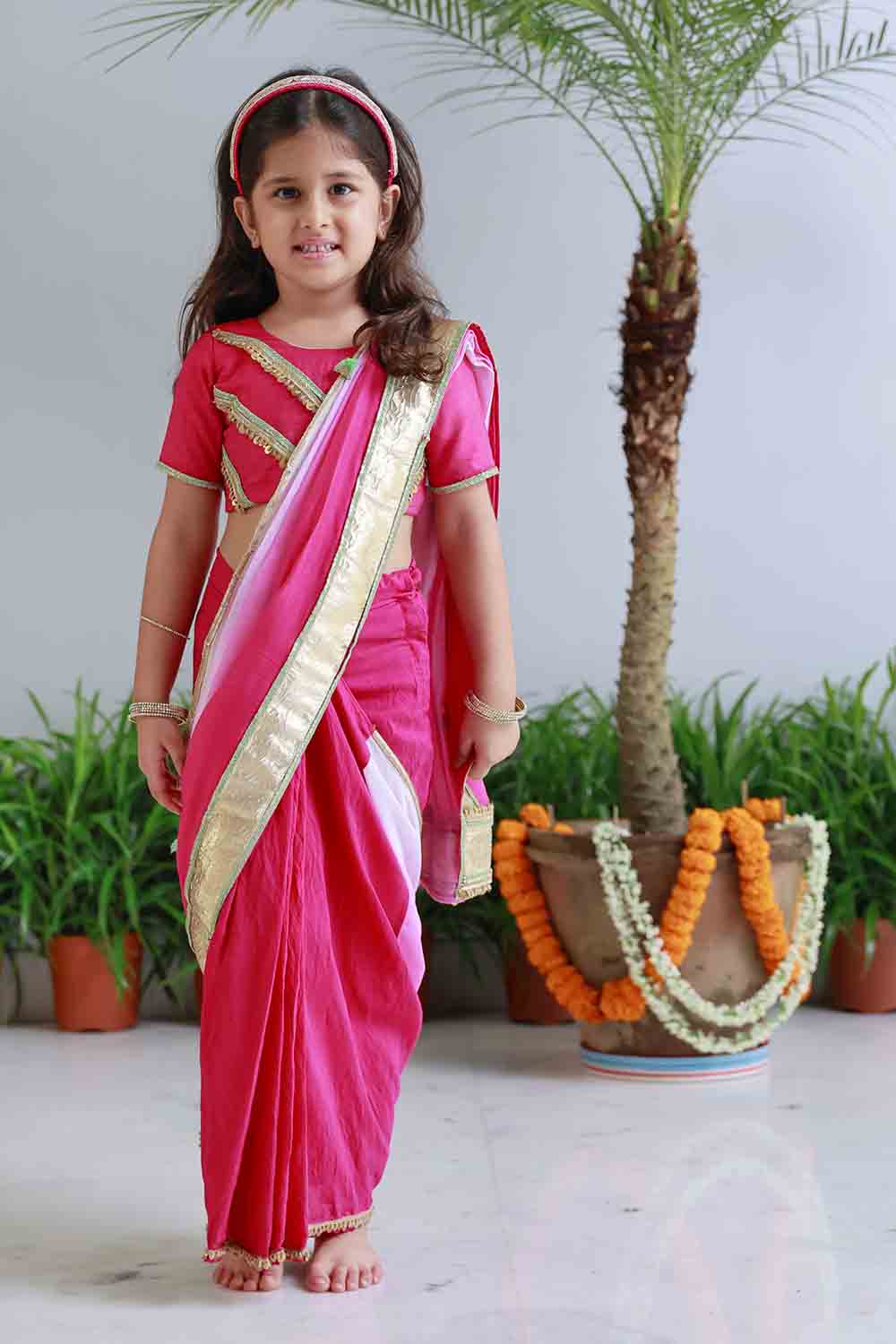 Fuchsia shaded pre draped sari for infant girls