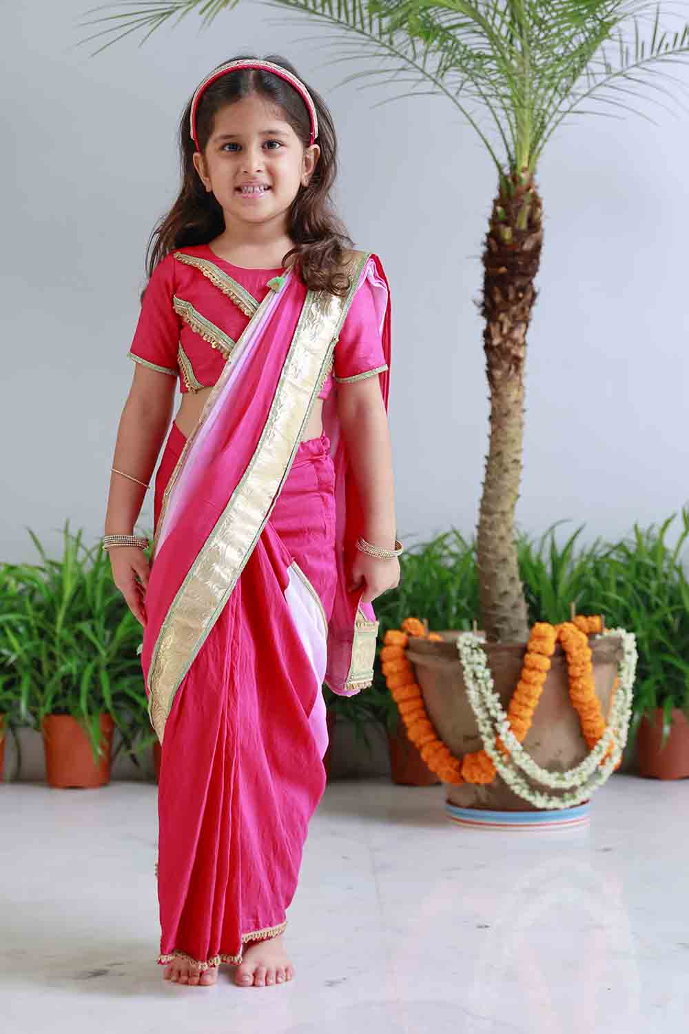 Fuchsia shaded pre draped sari for infant girls