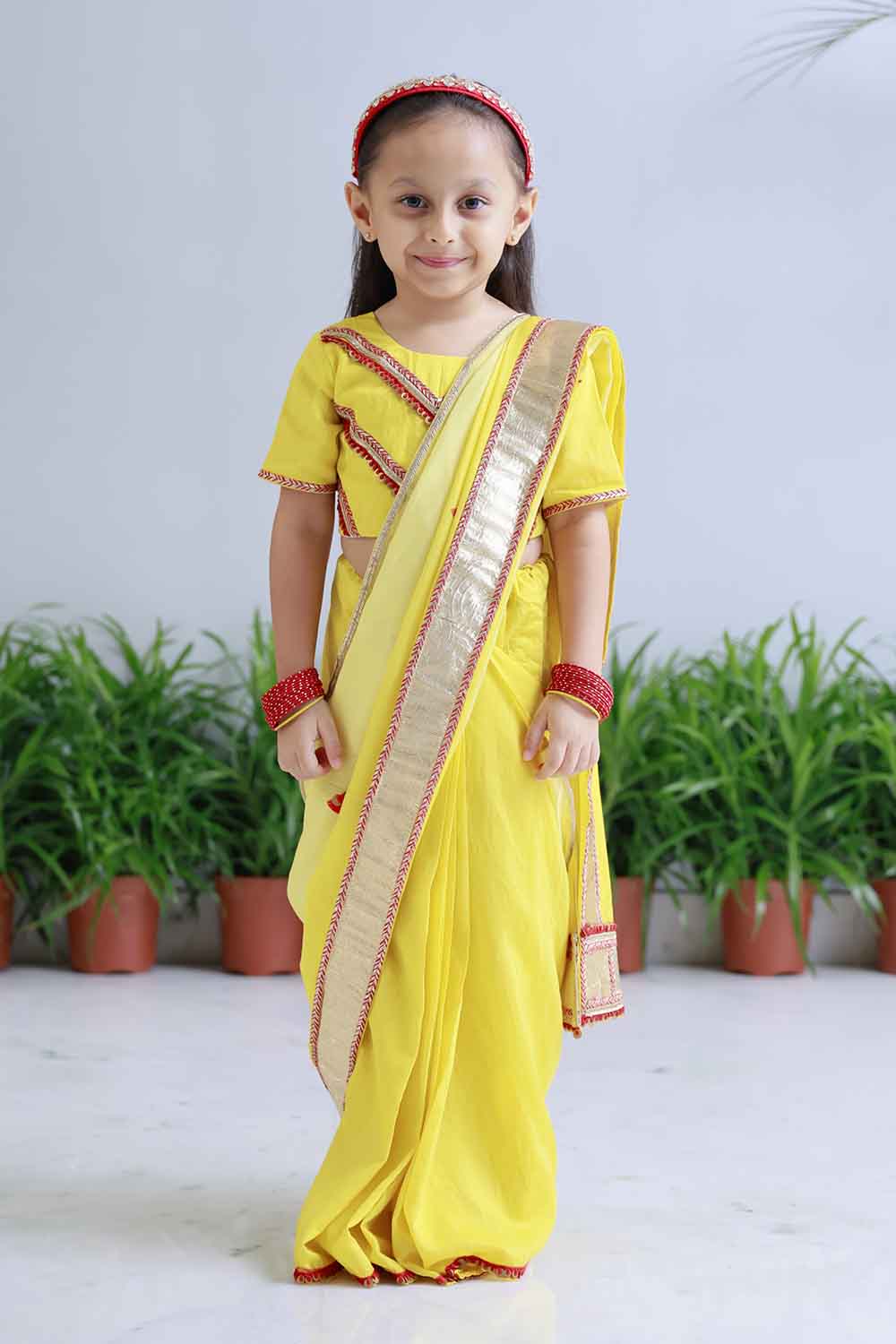 Yellow shaded pre draped sari for infant girls